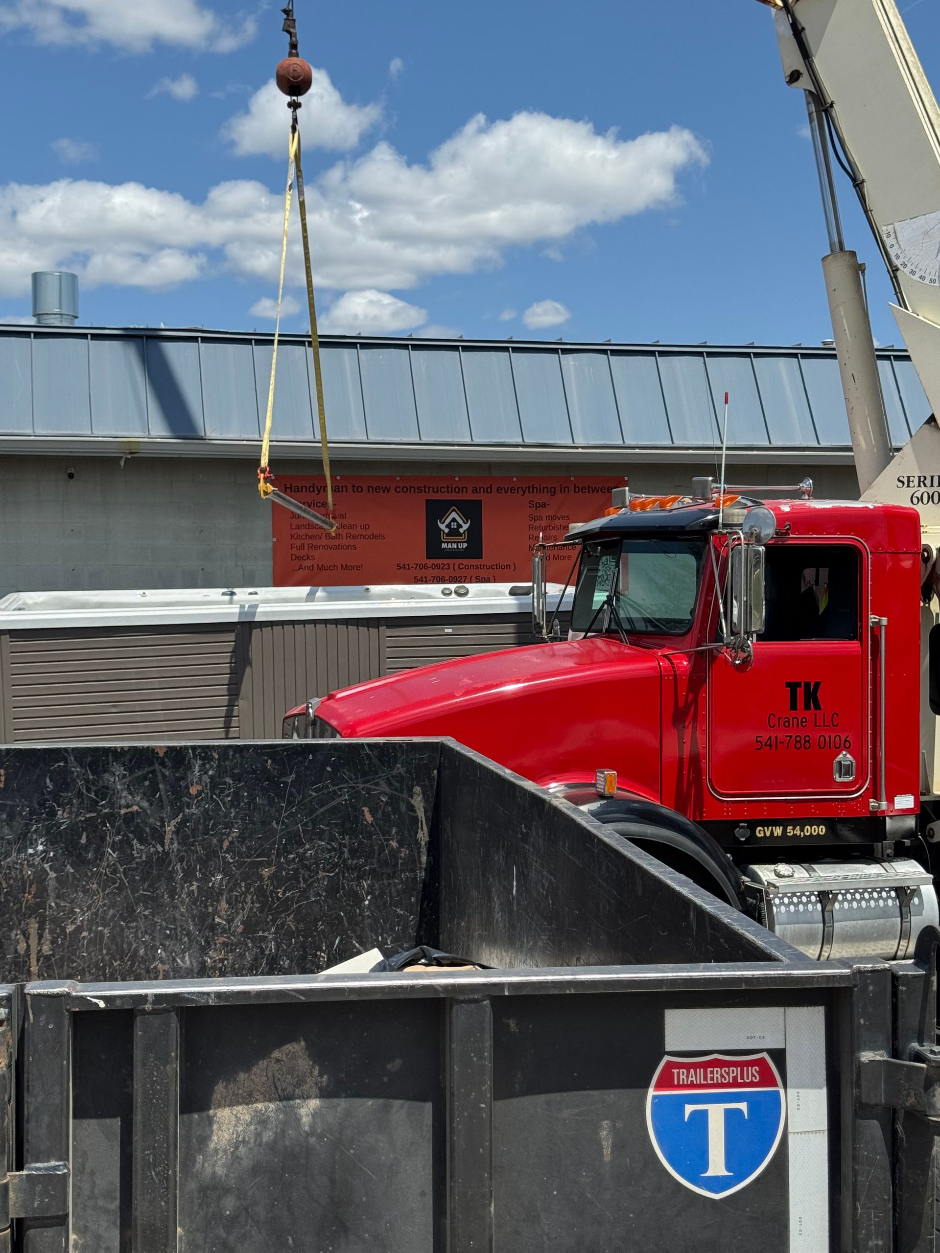 A dumpster with a highway t sticker on it