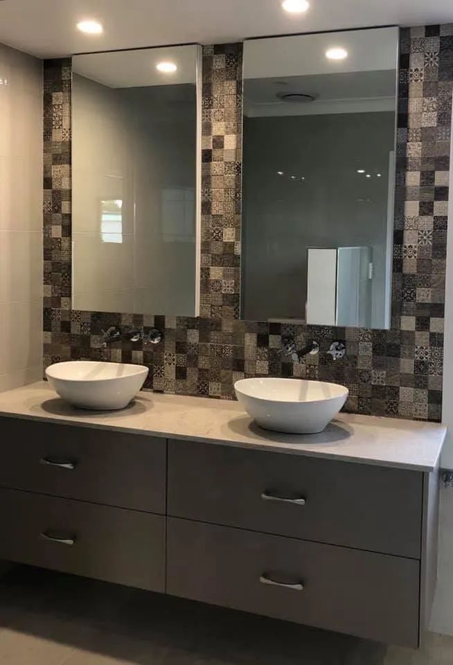 A Modern Bathroom With a Double Vanity, Two Vessel Sinks, and Large Mirrors Above a Gray Cabinet — North Coast Tiles in Iluka, NSW