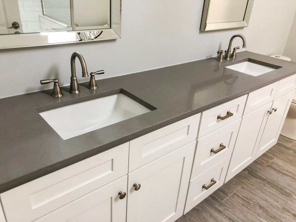 A Bathroom Vanity With a Gray Countertop and Two White Sinks Sits Under Two Mirrors — North Coast Tiles in Grafton, NSW