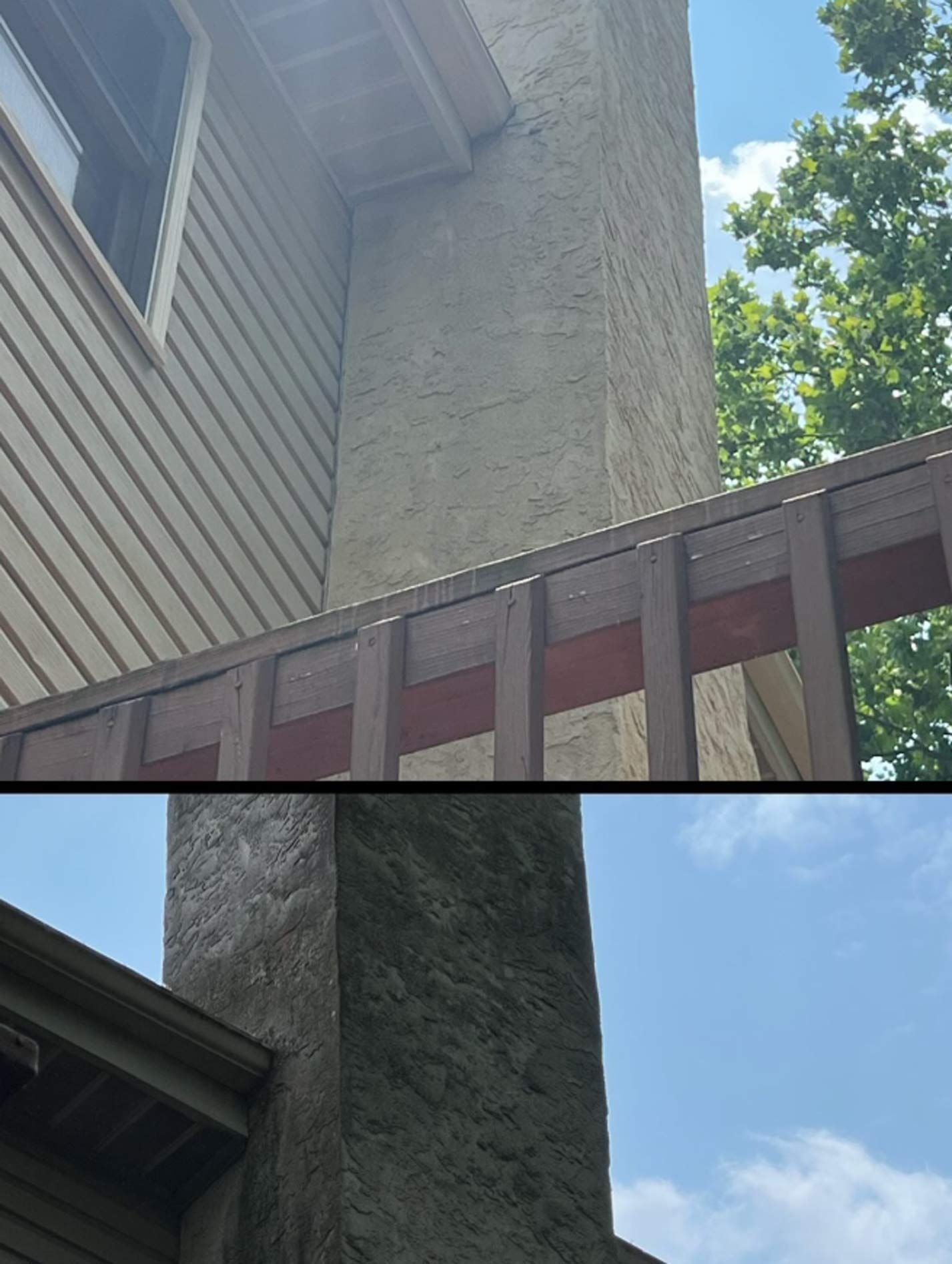 Chimney with textured stucco finish against a blue sky, adjacent to a wood deck railing and siding.
