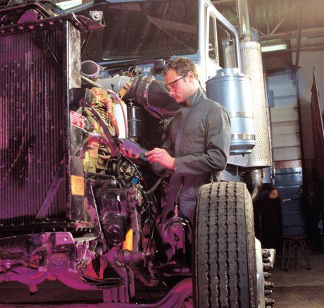 mechanic working on diesel truck