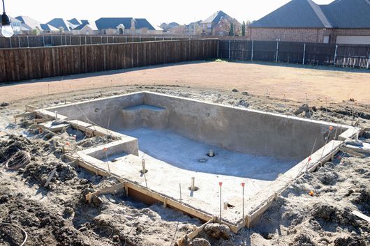 A stone walkway leading to the front door of a house.