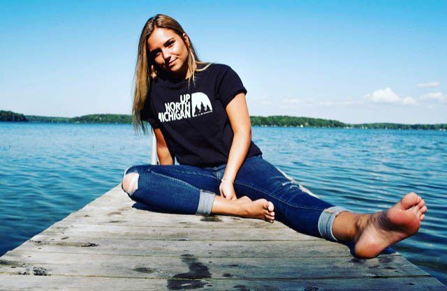 woman sitting beside the beach