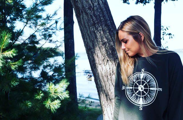 woman with dark blue sweat shirt