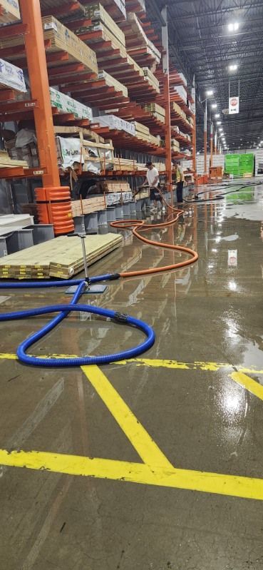 Man Catching the Water Leaks with a Bucket