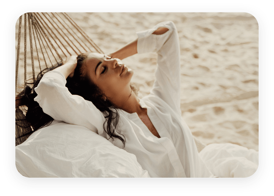 woman in a hammock on miami beach relaxing