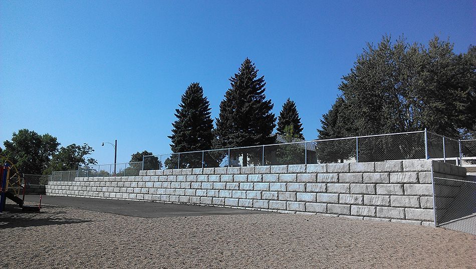 retaining wall with chainlink fence