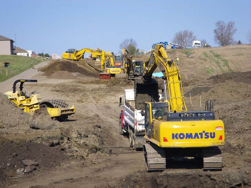 construction machinery moving concrete slab