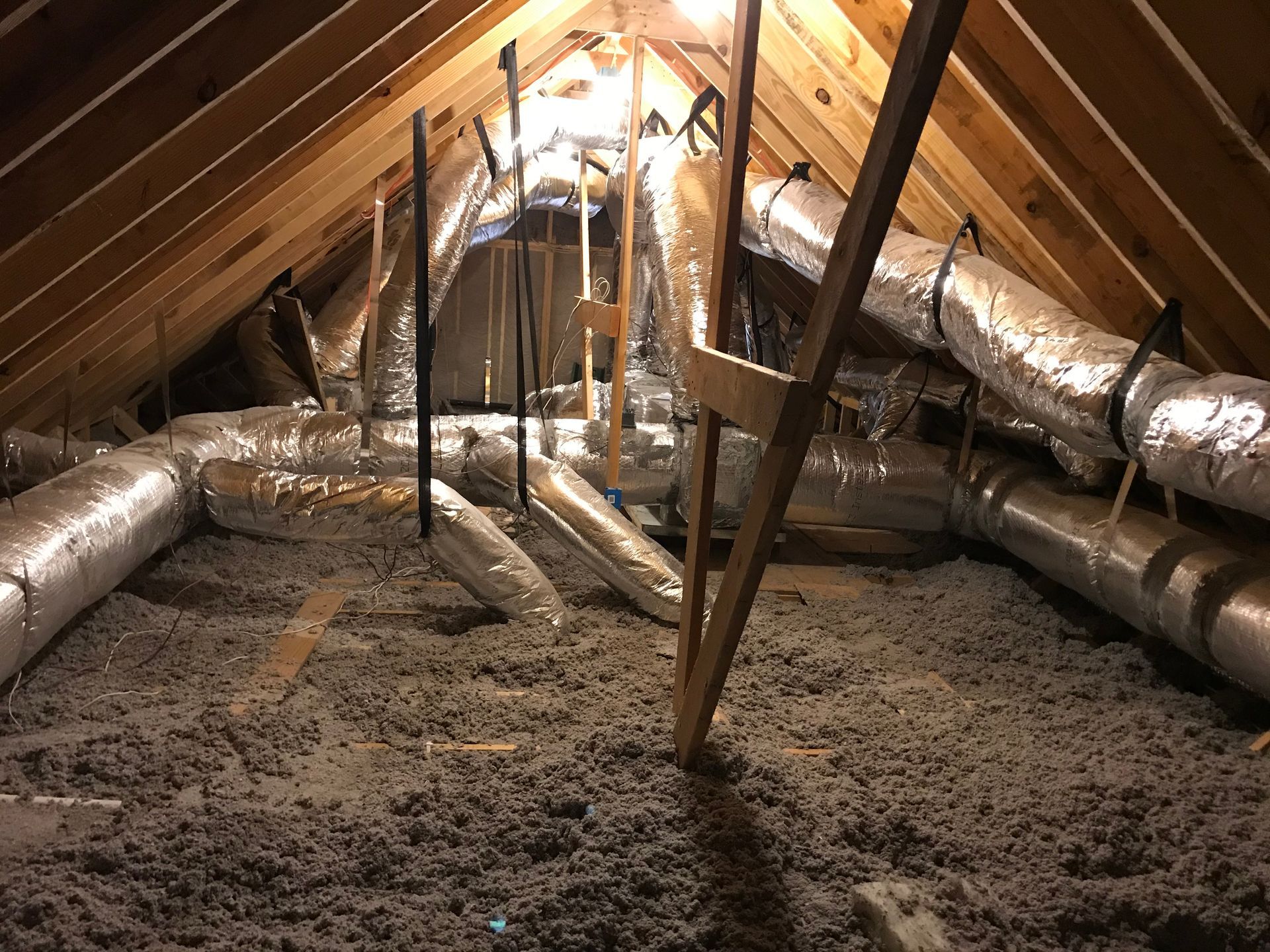 There are a lot of pipes in the attic.