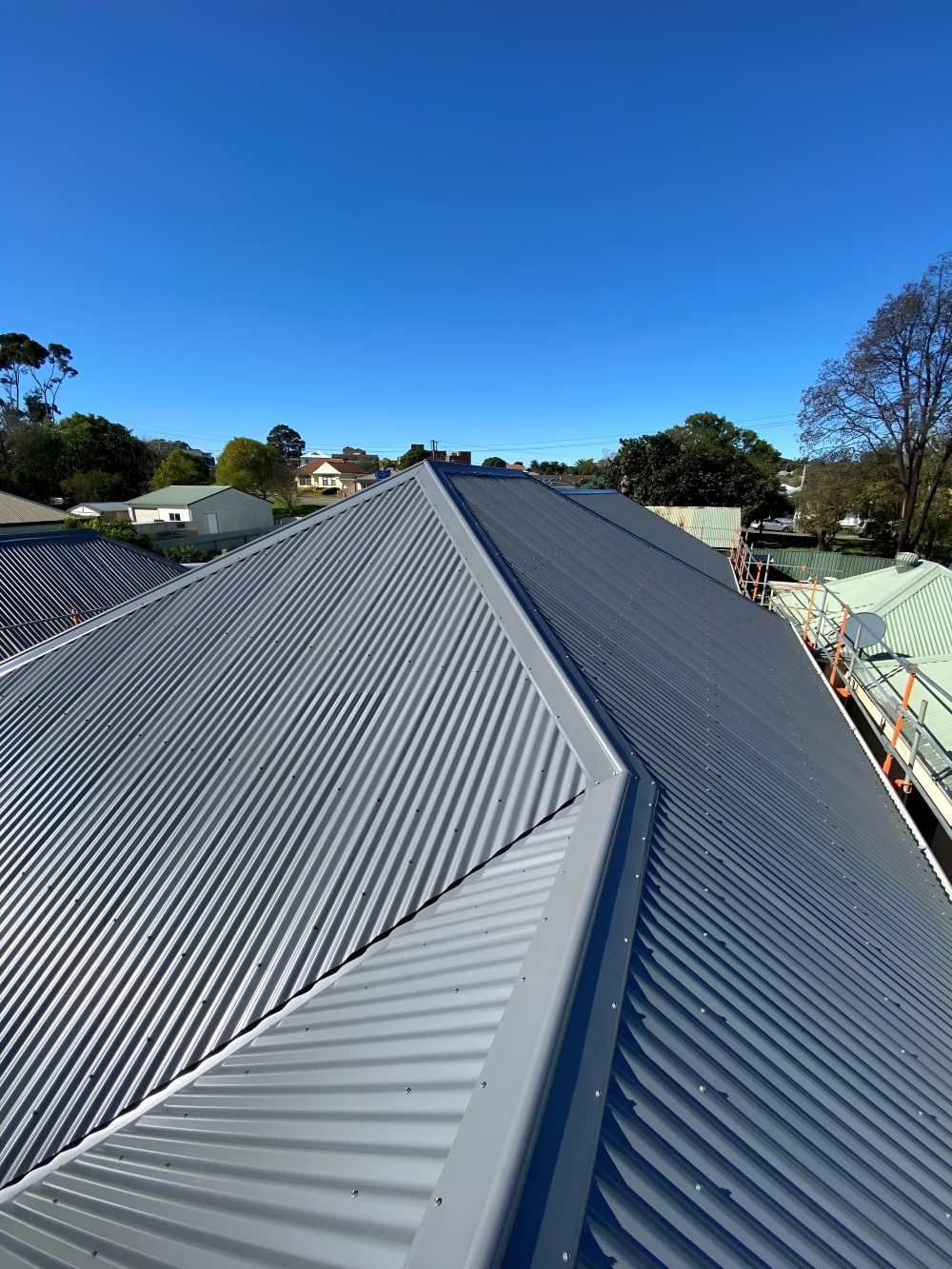 A Close Up of a Roof With a Blue Sky in the Background — Lake Valley Roofing in East Maitland, NSW