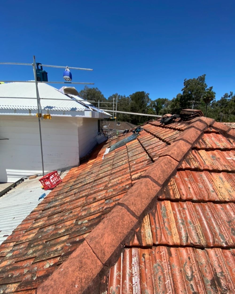 A Close Up of a Roof With a Blue Sky in the Background — Lake Valley Roofing in Eleebana, NSW