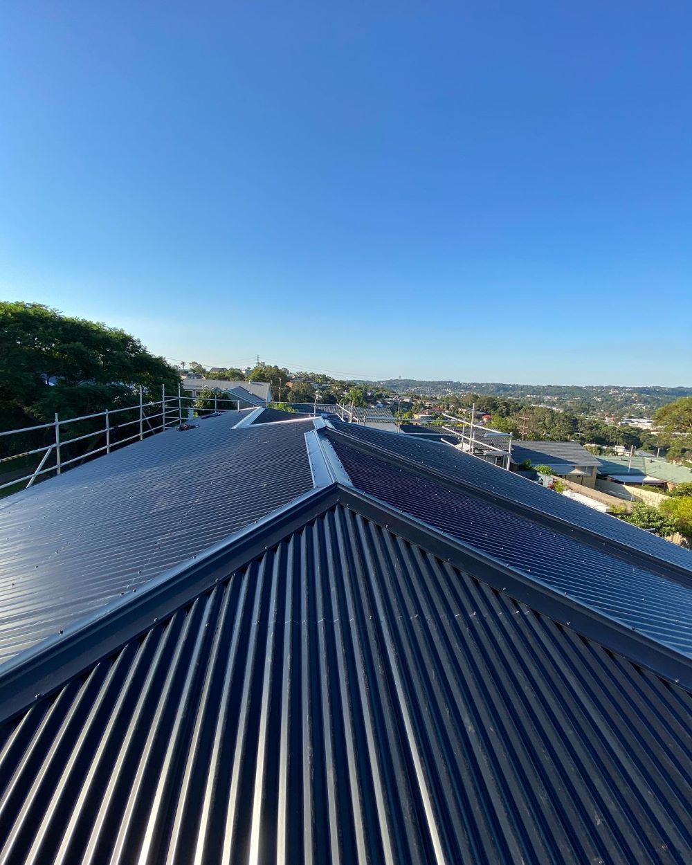 A Close Up of a Roof With a Blue Sky in the Background — Lake Valley Roofing in Merewether, NSW