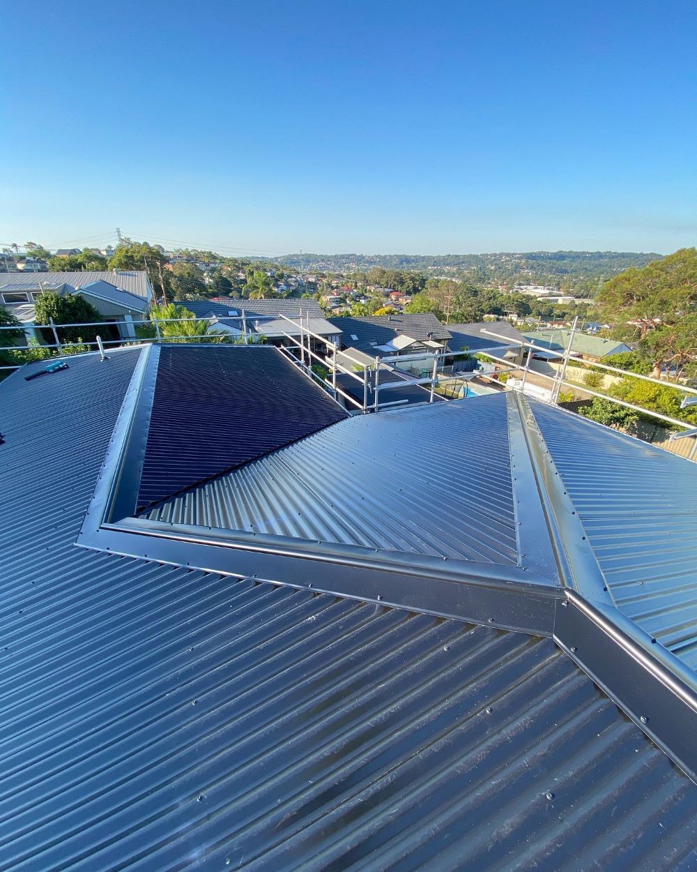 A Close Up of a Roof With a Blue Sky in the Background — Lake Valley Roofing in Newcastle, NSW