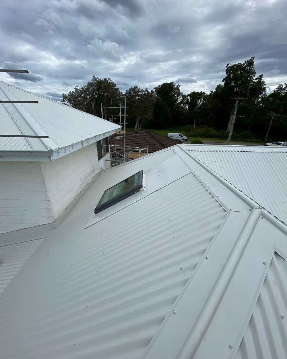 A White Roof With a Skylight on Top of It — Lake Valley Roofing in Rutherford, NSW