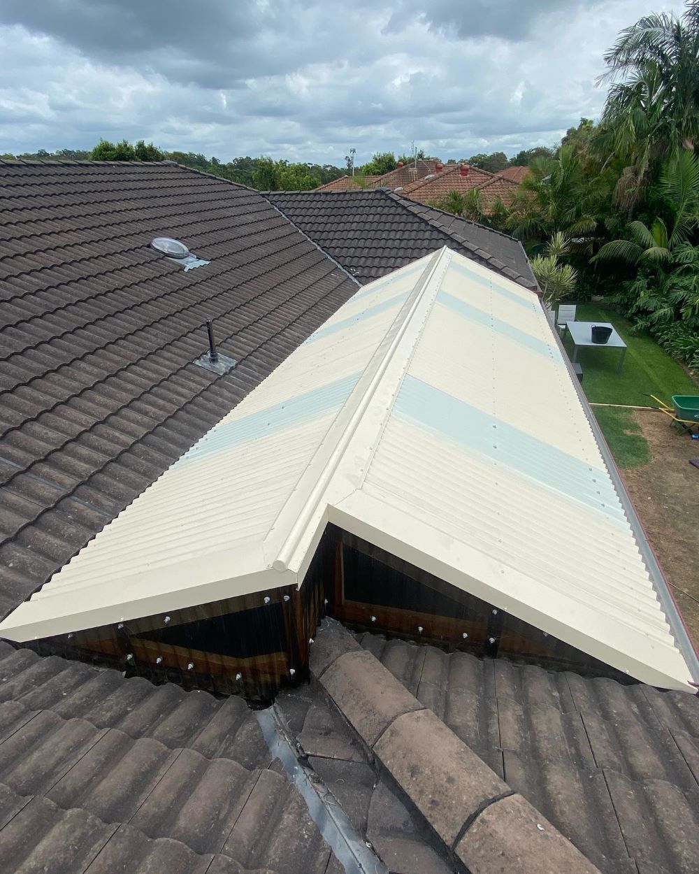 A Roof With a White Roof and a Window on It — Lake Valley Roofing in West Wallsend, NSW