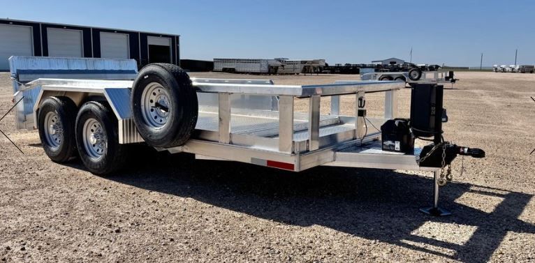 A yellow dumpster is parked in front of a house
