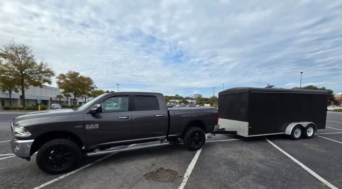 A trailer is parked in a parking lot.