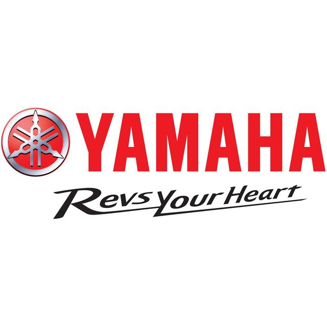 Yamaha logo in red with gray emblem and slogan “Revs Your Heart” in black script