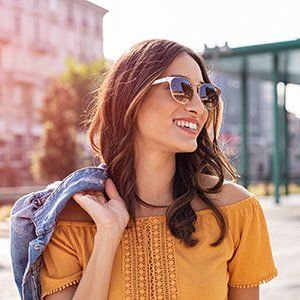 Eyeglasses — Young Woman Wearing Shades in Manasquan, NJ