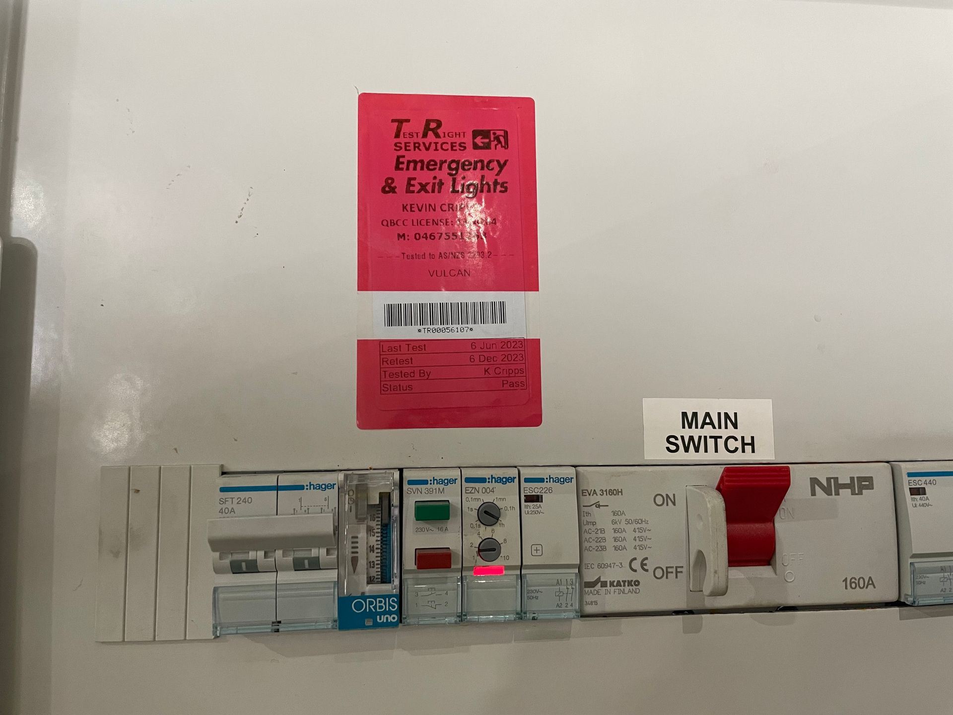 A Person Is Working on An Electrical Box with A Pen — Test Right Services in Kirwan, QLD