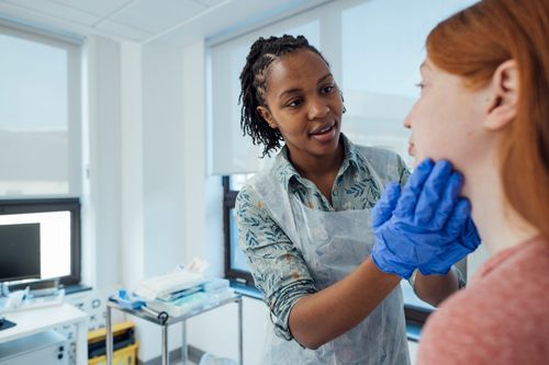Doctor examining patients condition. Doctor examining patients condition.