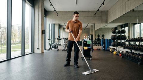 Professional cleaner sanitizing bar counter surfaces in restaurant, Inver Grove Heights, MN