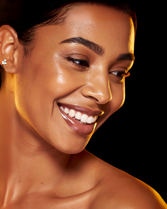 Woman with glowing, radiant skin after aesthetic treatment