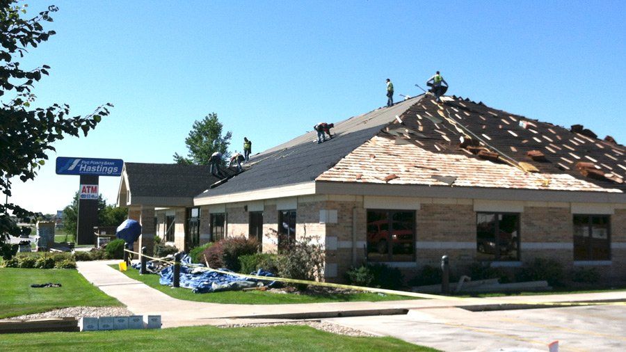 Flat Roof Restoration — Roofing Contractors Installing New Roof in Mission, KS