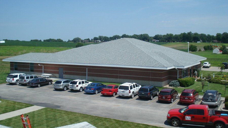Skyline Roofing — Clinic with Parked Cars in Mission, KS
