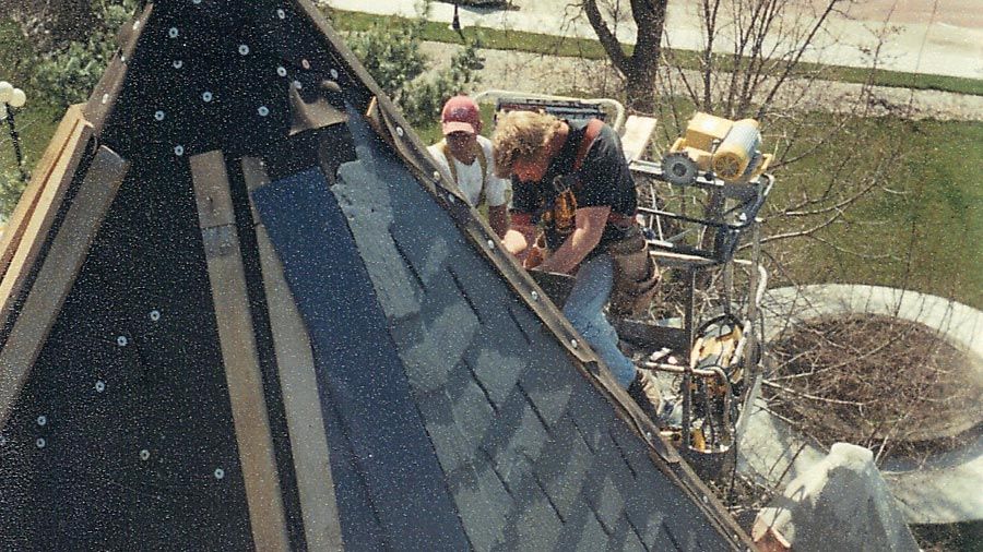 Skyline Contractor — Roofing Contractors Removing Old Existing Shingles in Mission, KS