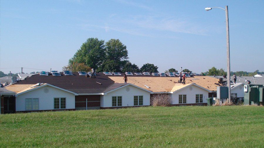 Skyline Roofing — Residential Houses Under Restoration in Mission, KS