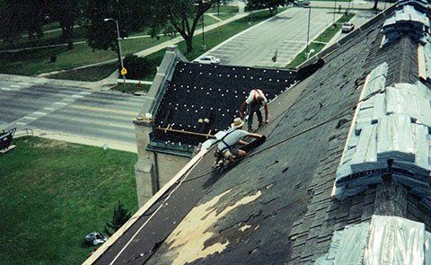 Roofing Contractors — Roofing Contractors Installing Slate Roofing Tiles in Mission, KS