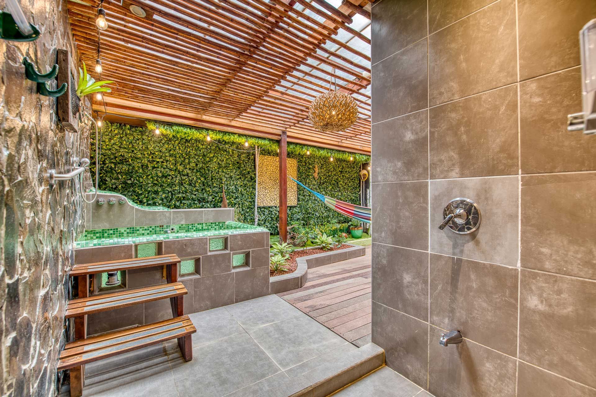 A bathroom with a walk in shower and a hot tub.