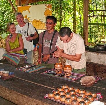 A group of people are gathered around a table with a map in the background