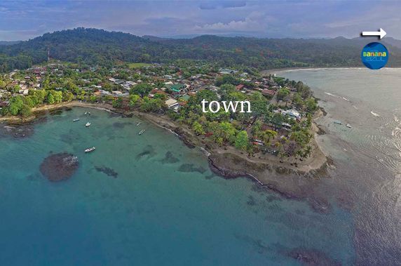 An aerial view of a small island in the middle of the ocean.
