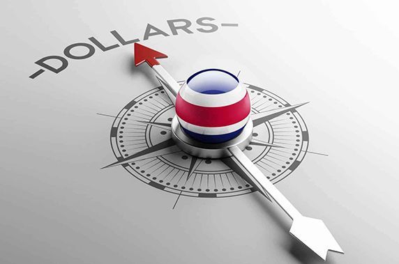 A compass with the word dollars on it