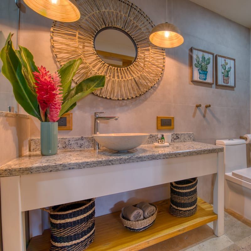 A bathroom with a sink and a mirror on the wall