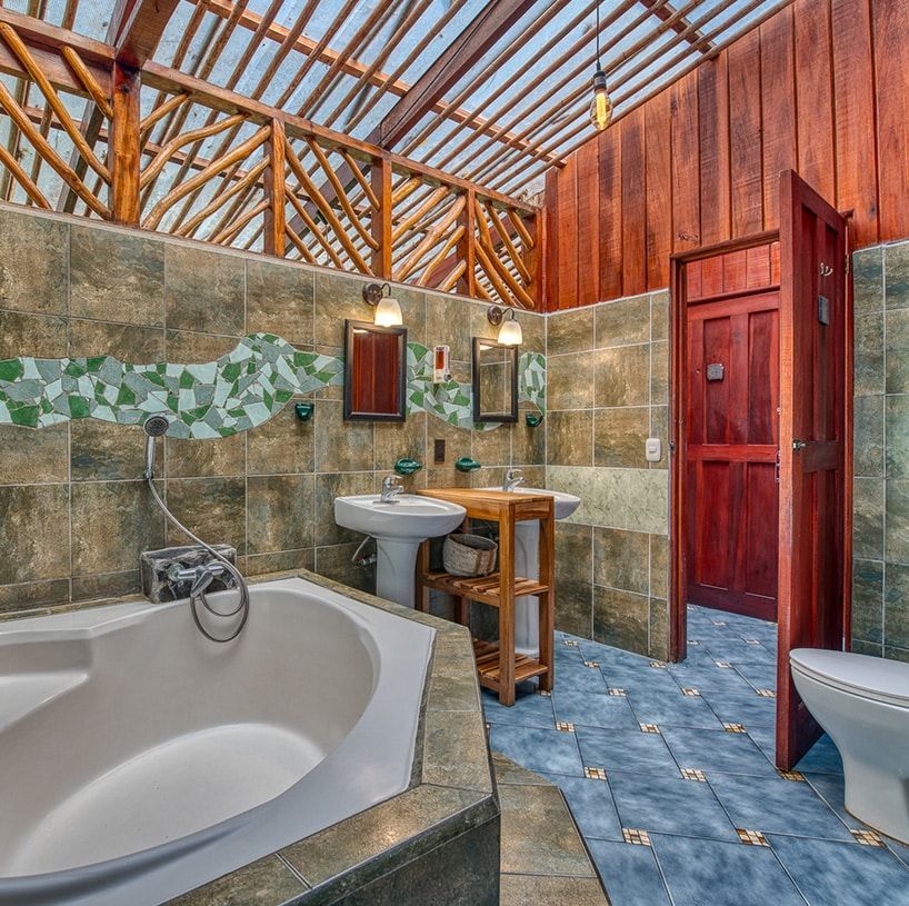 A bathroom with a bathtub a sink and a toilet