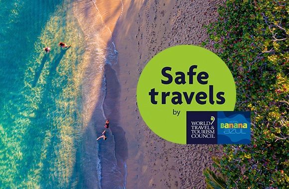 An aerial view of a beach with the words safe travels on it