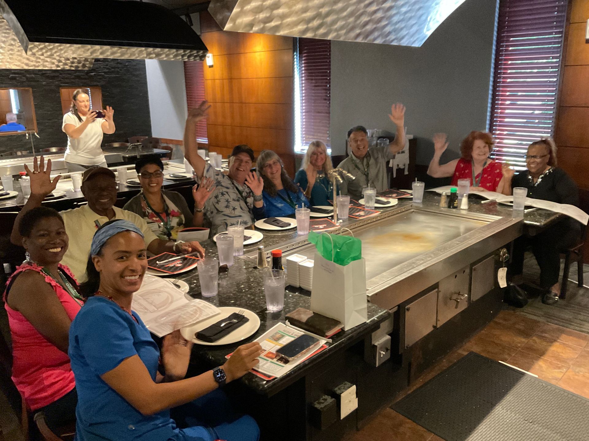 A group of Summerlin Gold clients sitting at a table in a restaurant