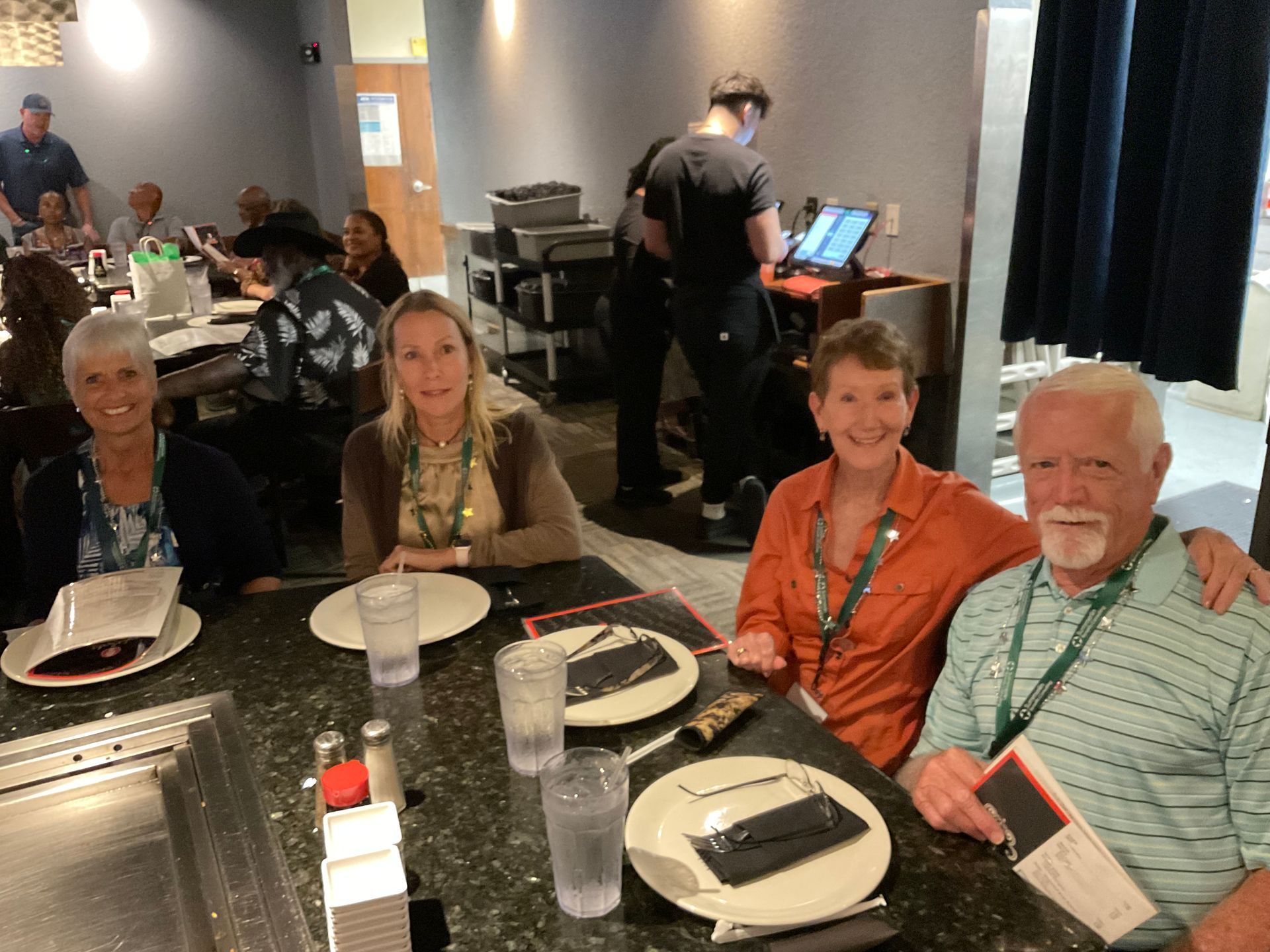 Four Summerlin clients sitting at a table in a restaurant