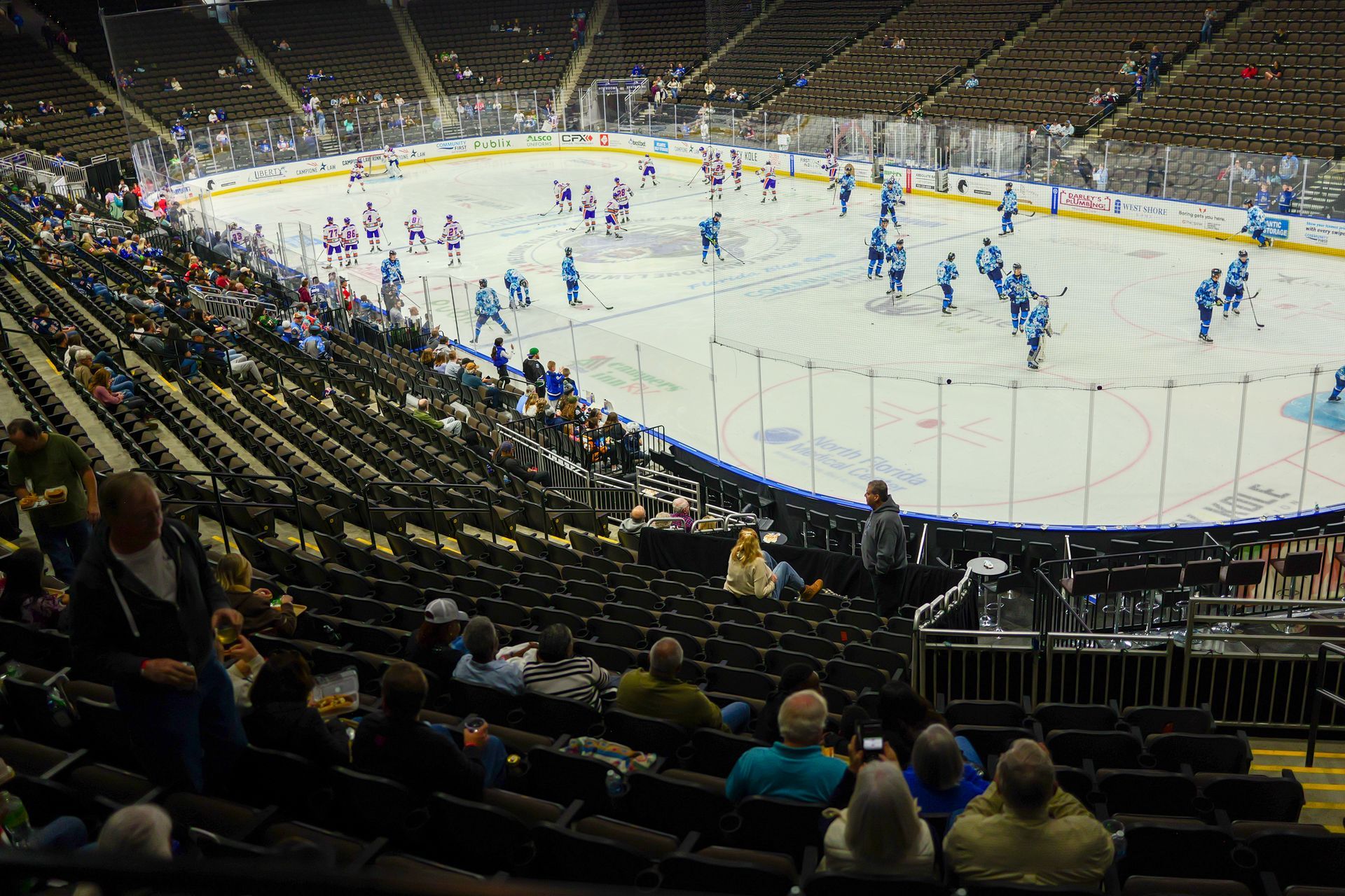 A hockey game is being played in an empty stadium