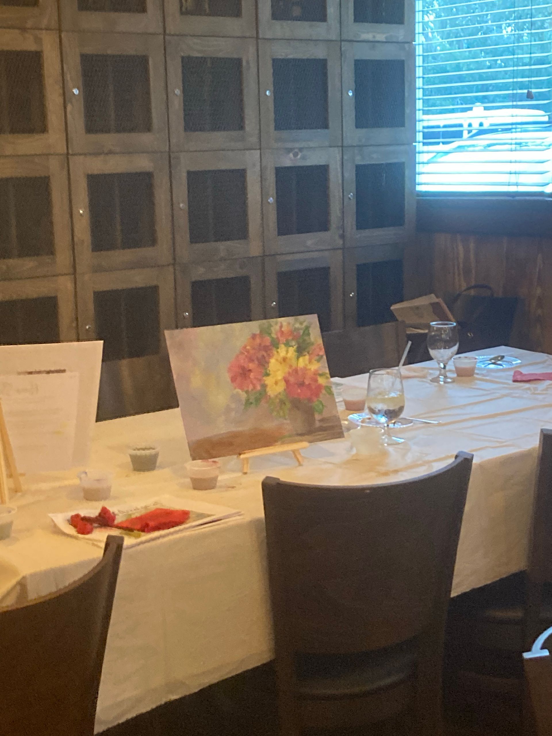 A table with a painting of flowers on it
