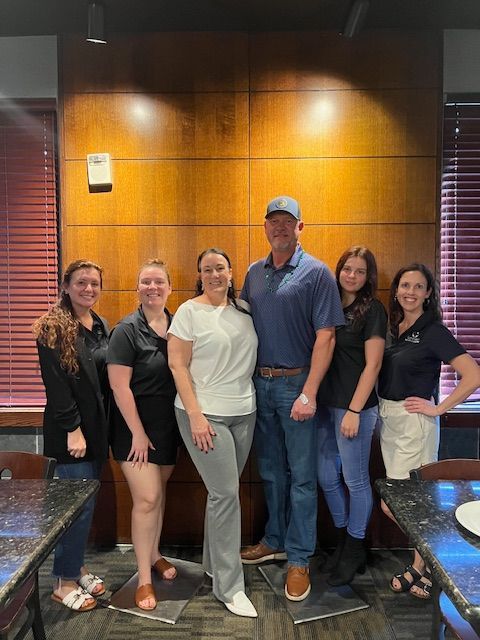 The Summerlin team posing for a picture in a restaurant