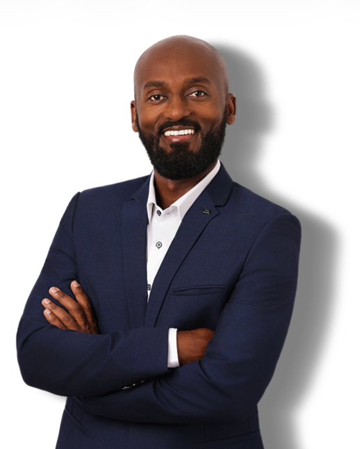 A man in a suit and tie is smiling for the camera.