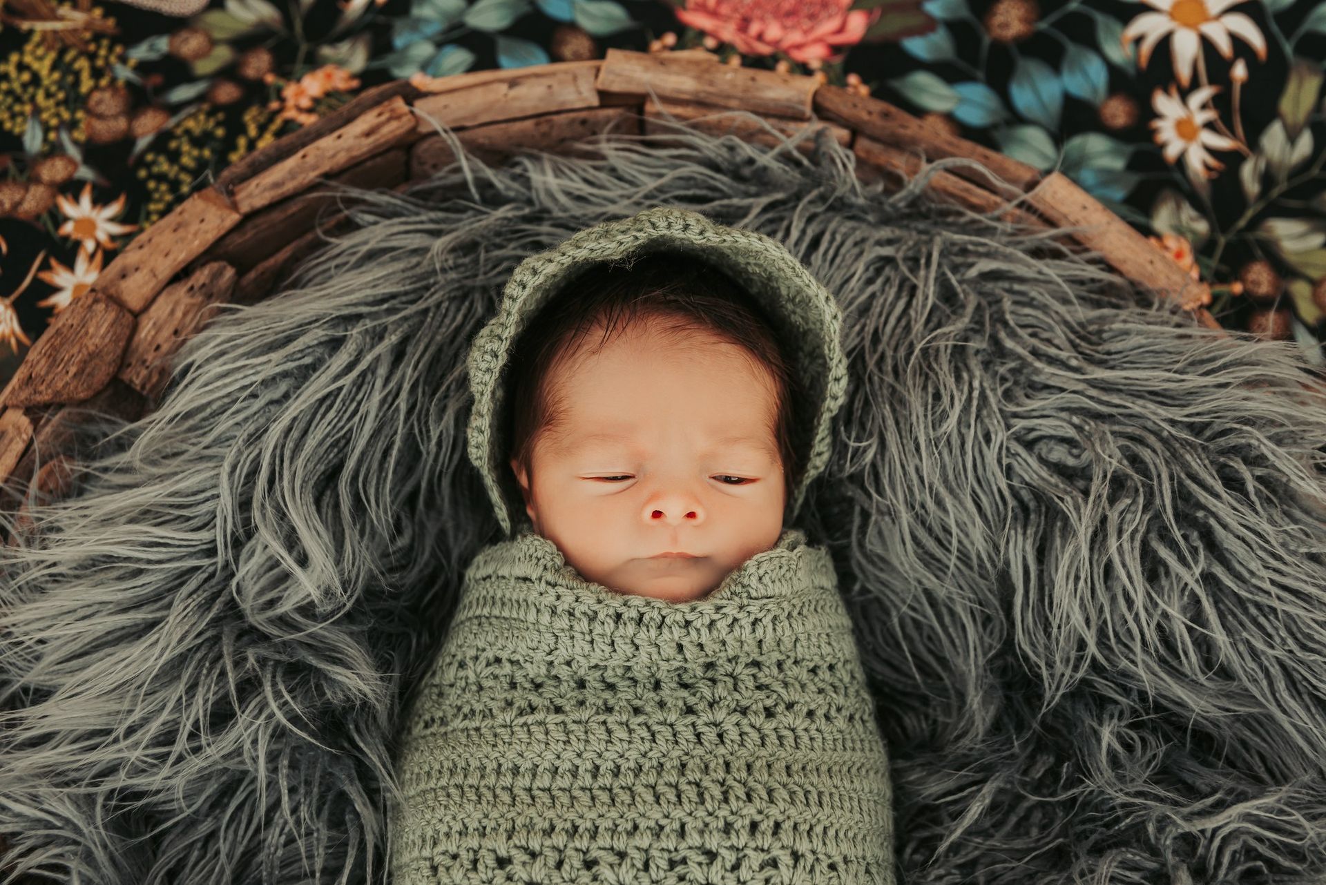 Newborn Wrapped in Green Blanket and Bonnet — Feathers & Lace Photography in Tarzali, QLD