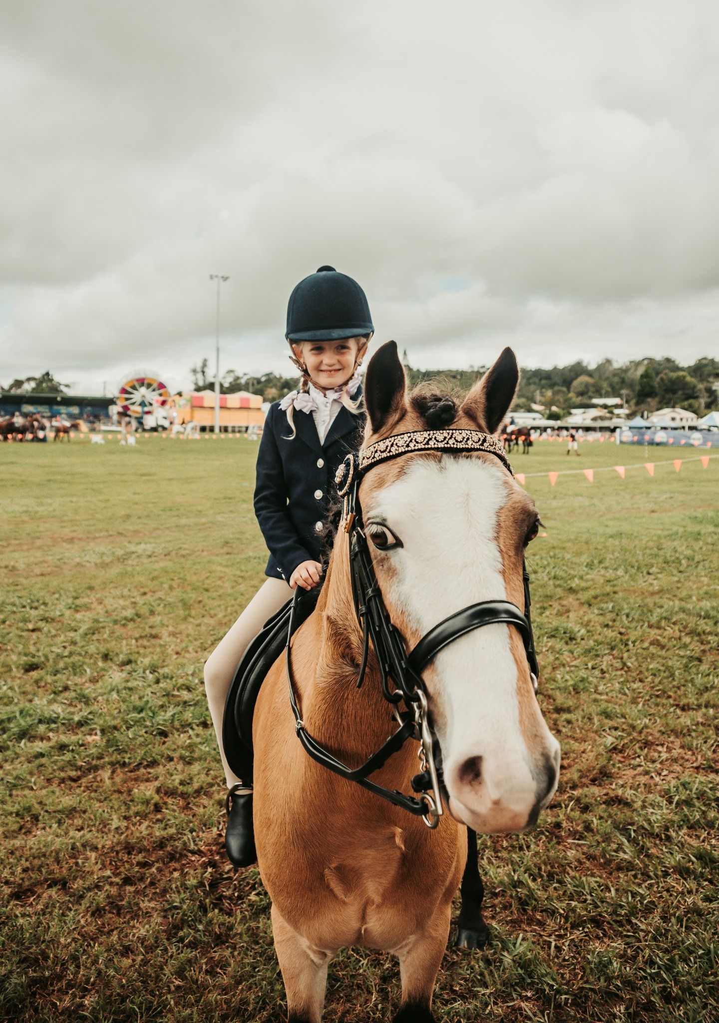 Young Rider in Riding Attire on a Light Brown Horse With a White Face — Feathers & Lace Photography in Tarzali, QLD