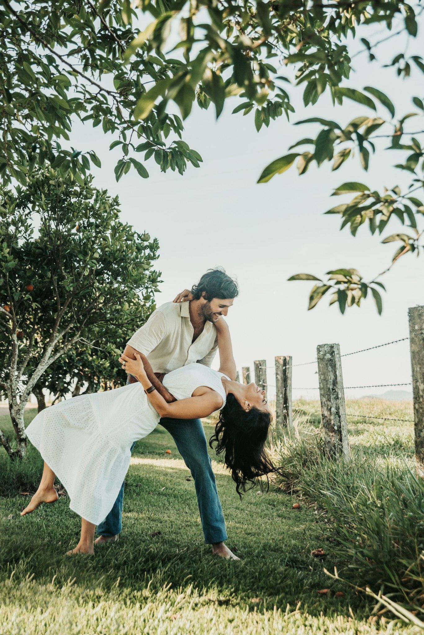Couple Dancing Outdoors, the Woman Leaning Back, the Man Holding Her — Feathers & Lace Photography in Tarzali, QLD