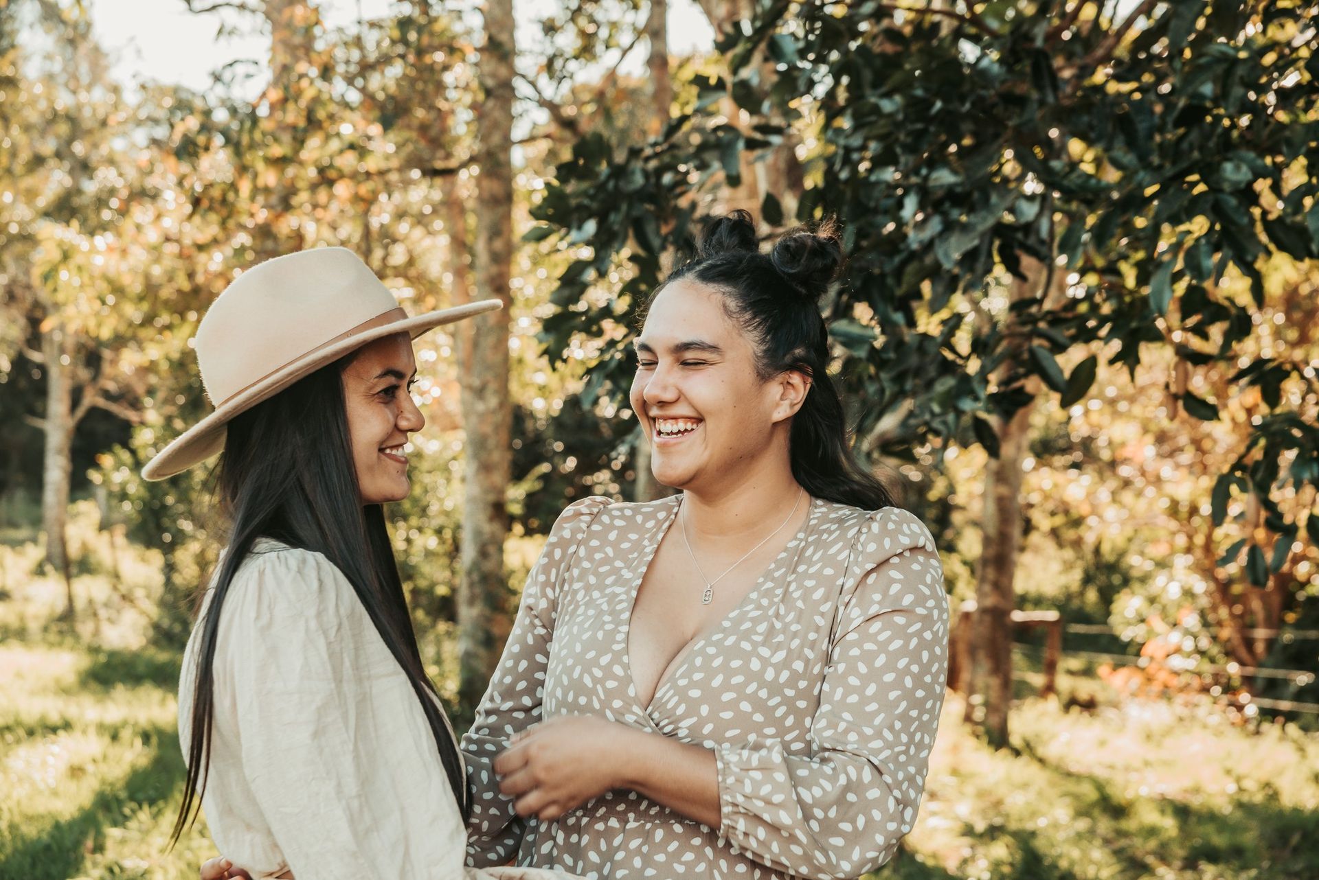 Two Smiling People in a Sunlit Outdoor Setting — Feathers & Lace Photography in Tarzali, QLD