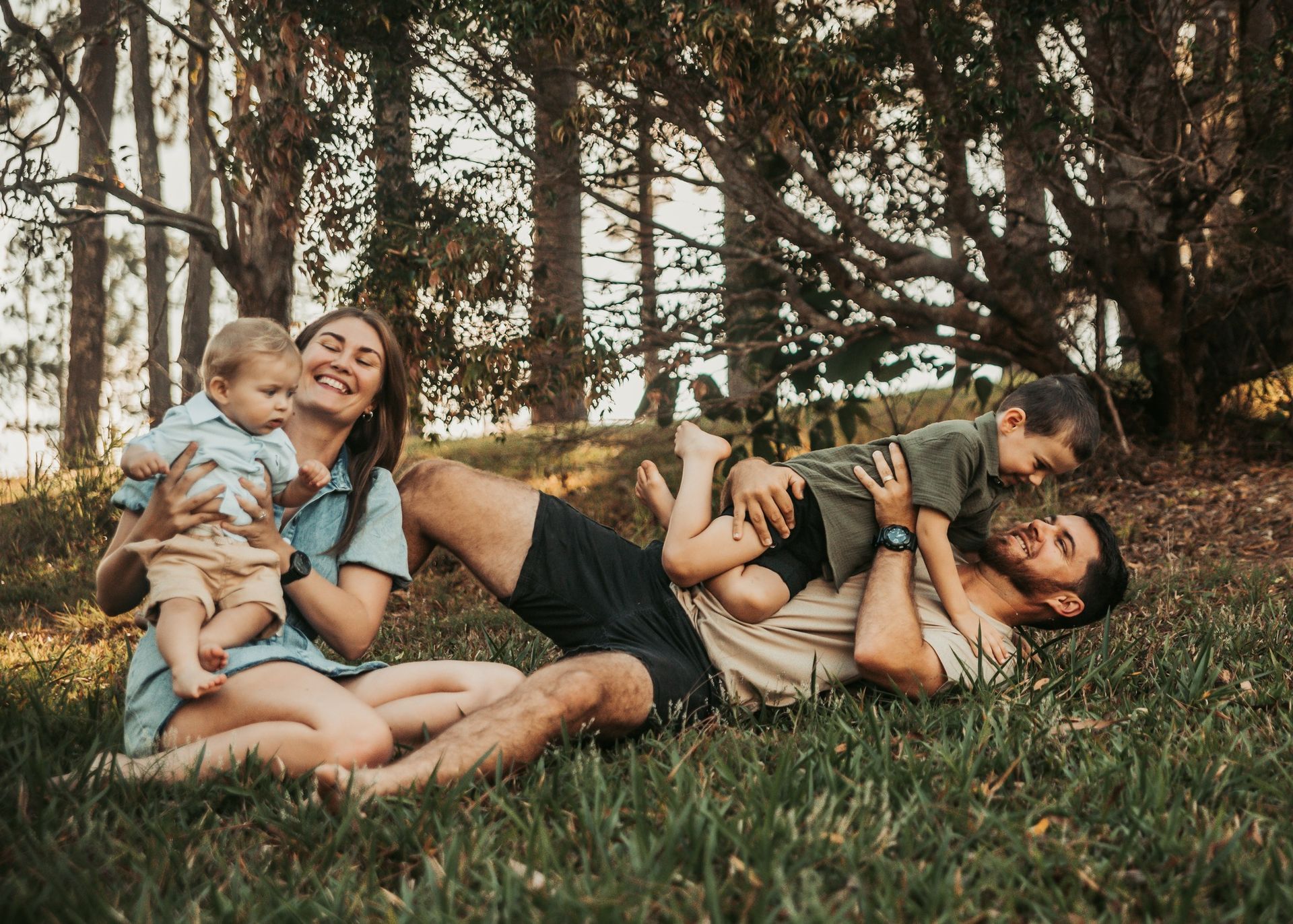 Family of Four Having Fun in a Grassy Field — Feathers & Lace Photography in Tarzali, QLD